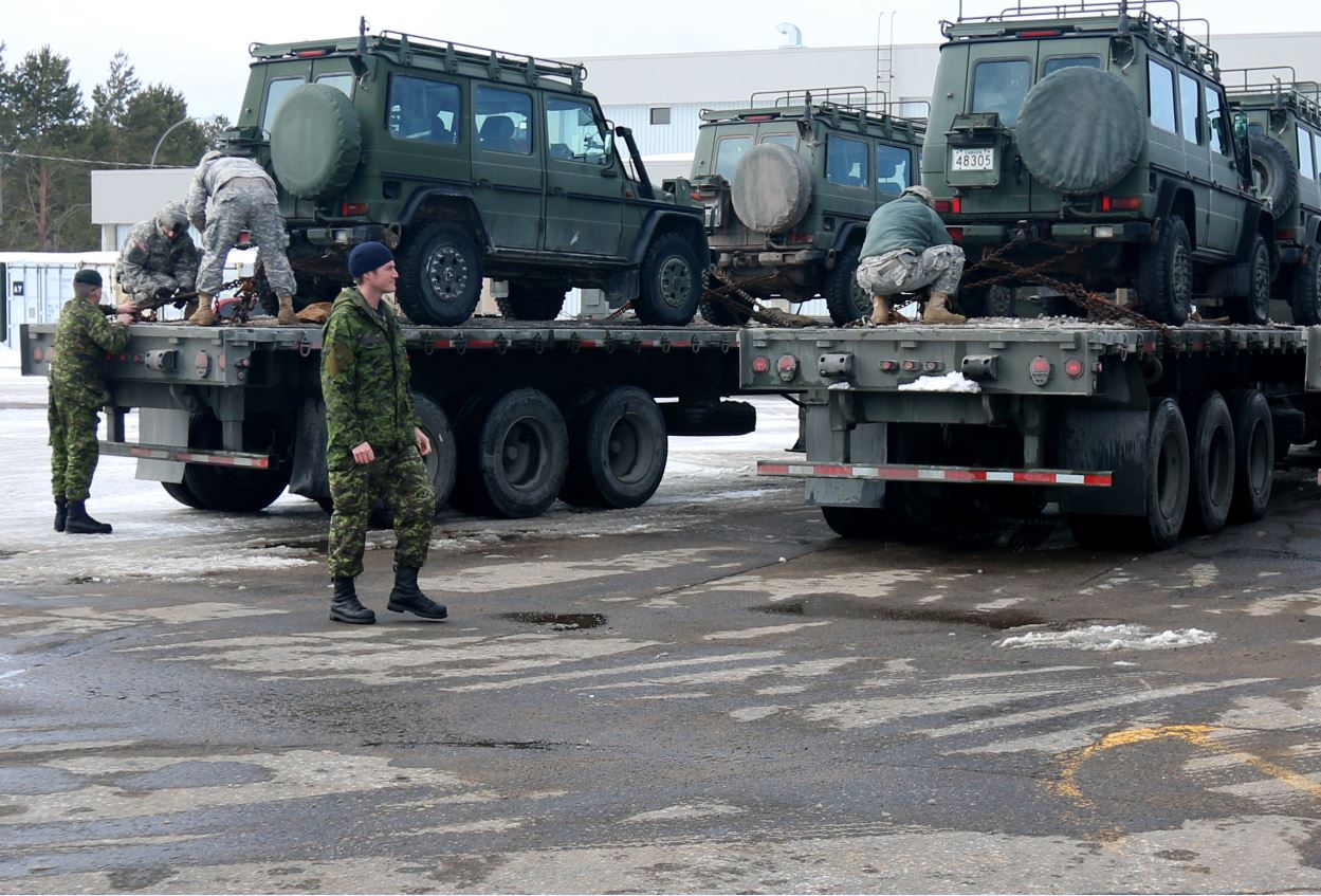 Canadian Army soldiers out of Canadian Forces Base Valcartier assist Soldiers of the619th Transportation Company, Auburn, Maine, the 812thTransportation Battalion, Charlotte, N.C., and the 316thSustainment Command (Expeditionary), Coraopolis, Pa., in loading Army Reserve trucks with Canadian equipment as they begin a more than 2,500-mile journey across Canada.Soldiers experienced cross-border logistics, inclement weather conditions, operating on foreign roadways and interacting with the Canadian Army. This historic logistical exercise marks the first time an Army Reserve transportation unit has conducted a long haul mission across Canada Canadian Army soldiers out of Canadian Forces Base Valcartier assist Soldiers of the619th Transportation Company, Auburn, Maine, the 812thTransportation Battalion, Charlotte, N.C., and the 316thSustainment Command (Expeditionary), Coraopolis, Pa., in loading Army Reserve trucks with Canadian equipment as they begin a more than 2,500-mile journey across Canada.Soldiers experienced cross-border logistics, inclement weather conditions, operating on foreign roadways and interacting with the Canadian Army. This historic logistical exercise marks the first time an Army Reserve transportation unit has conducted a long haul mission across Canada