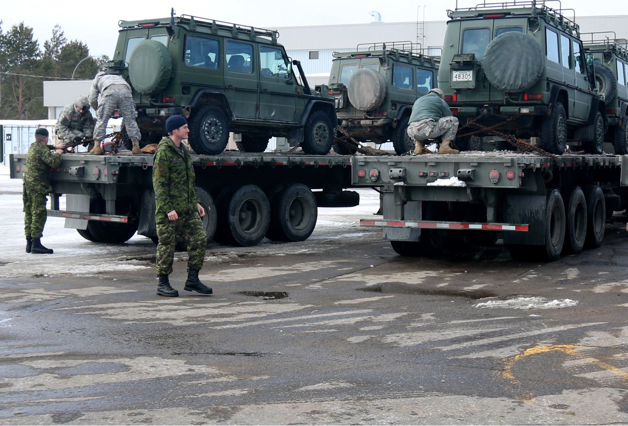 Canadian Army soldiers out of Canadian Forces Base Valcartier assist Soldiers of the619th Transportation Company, Auburn, Maine, the 812thTransportation Battalion, Charlotte, N.C., and the 316thSustainment Command (Expeditionary), Coraopolis, Pa., in loading Army Reserve trucks with Canadian equipment as they begin a more than 2,500-mile journey across Canada.Soldiers experienced cross-border logistics, inclement weather conditions, operating on foreign roadways and interacting with the Canadian Army. This historic logistical exercise marks the first time an Army Reserve transportation unit has conducted a long haul mission across Canada