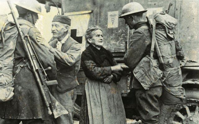 Soldiers of the 308th Infantry Regiment, 77th Infantry Division, and 166th Infantry Regiment, 42nd Infantry Division liberate a small town in France Soldiers of the 308th Infantry Regiment, 77th Infantry Division, and 166th Infantry Regiment, 42nd Infantry Division liberate a small town in France